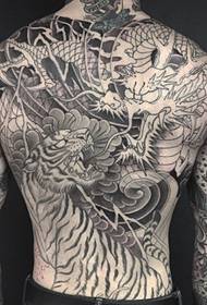 Men's full back dragon and tiger battle tattoo pattern
