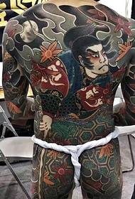 Дві власні великі дизайни татуювань на повній спині