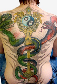 Boy's back personality full of snakes and key tattoo
