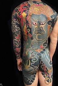 Full of unrecognizable Ming Wang tattoo pattern