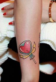 small and exquisite love candy arm tattoo