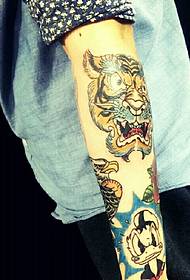 a wonderful rich zoo flower arm tattoo