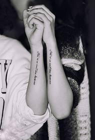 Long couple English tattoos on the arm