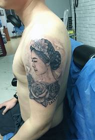 strong man's arm on the micro-closed eyes of the Madonna's personality totem