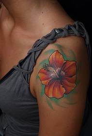 girl left shoulder orange hibiscus tattoo