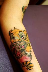 arm has a very playable little tiger tattoo