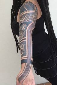 very masculine black and white arm totem tattoo