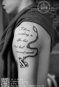 Shoulder superman logo tattoo