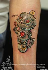 Small robot tattoo pattern on the arm