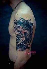 Boy arm wrestling shark tattoo picture