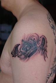Foto tatuaggio braccio re corona