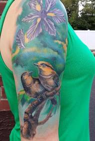 A pair of cute love birds tattoo designs
