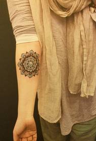 Female arm colored nice flower tattoo pattern
