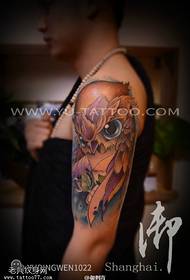 Foto tatuaggio braccio gufo