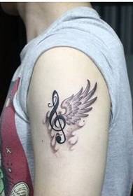 Mode jongen armen vleugels met muzikale tattoo patroon