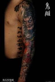 Modello tatuaggio braccia campane gravi