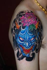 a fierce prajna tattoo on the upper arm