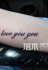Lady arm letter tattoo