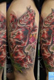 Colorful koi lotus tattoo on arm