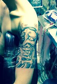 Handsome prajna tattoo on the big arm