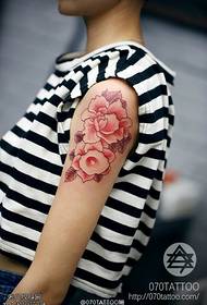 Shoulder monochrome red trumpet tattoo pattern
