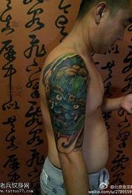 Arm dark green tyrant tattoo pattern