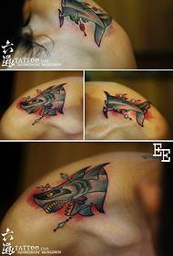Shoulder interspersed with tiger head shark tattoo pattern