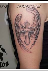 Arm with wings, cross tattoo