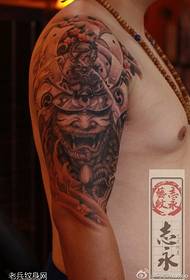 Arm yepamusoro yekudada tattoo maitiro