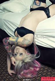 Woman arm colored flower arm tattoo work