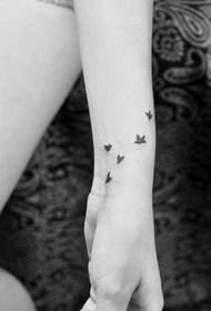Girl child arm popular totem pigeon tattoo patroon
