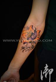 Female arm lotus tattoo picture