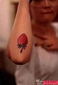 Arm strawberry tattoo