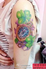 Arm clock, four-leaf clover, tattoo
