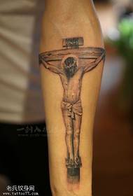 Arm Jesus tatueringar delas av tatueringshallen