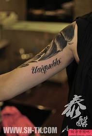 male arm tattoo inside the male alphabet