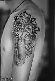 Tattoo show, rekommenderar en arm svart och vit elefant gud figur
