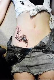 Girls belly blooming flower tattoo