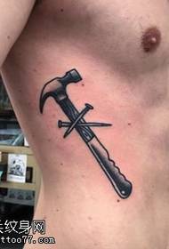flank nail hammer tattoo pattern