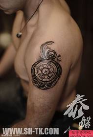 male arm totem clock tattoo pattern