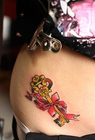 female belly gold key tattoo pattern