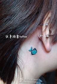 a girl's neck cute little fish tattoo pattern
