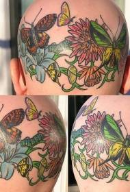 galvos spalvos drugelio ir gėlių tatuiruotės paveikslėlis