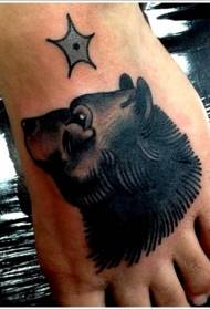 pied tête d'ours noir et motif de tatouage étoile