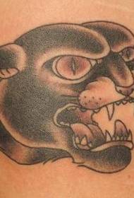 Черная татуировка с изображением головы леопарда