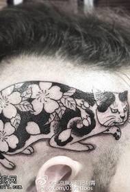 disegno del tatuaggio del gatto sulla testa