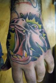 patrón de tatuaje de hipopótamo con fondo verde en la mano