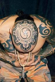 Stulbinantis vyrų galvos totemo tatuiruotė