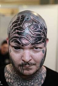 татуировка головы паука