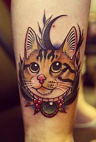 colorful cat tattoo pattern with big eyes at the calf
